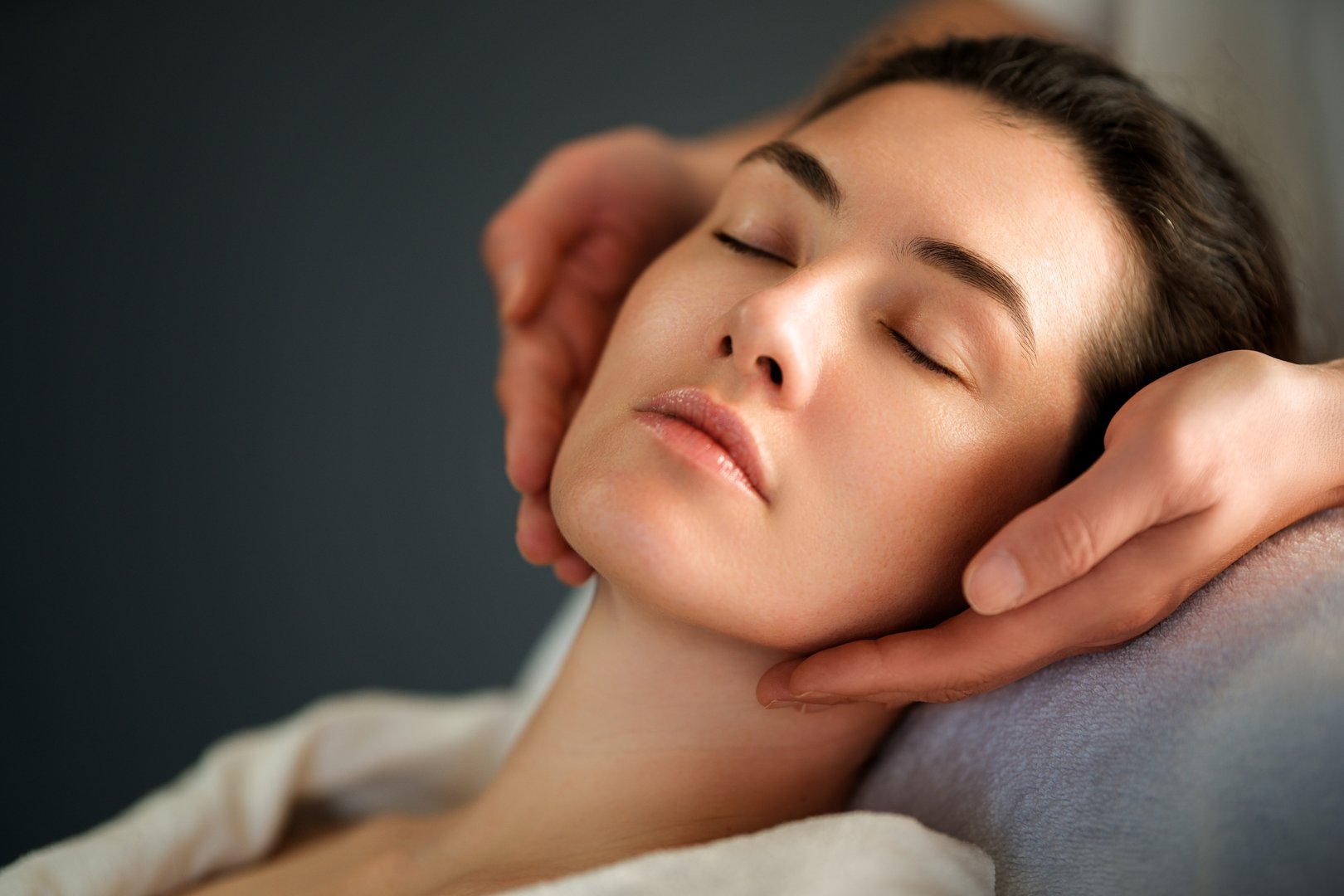 Facial treatment in spa salon. Skin care and massage. Cosmetologist at work