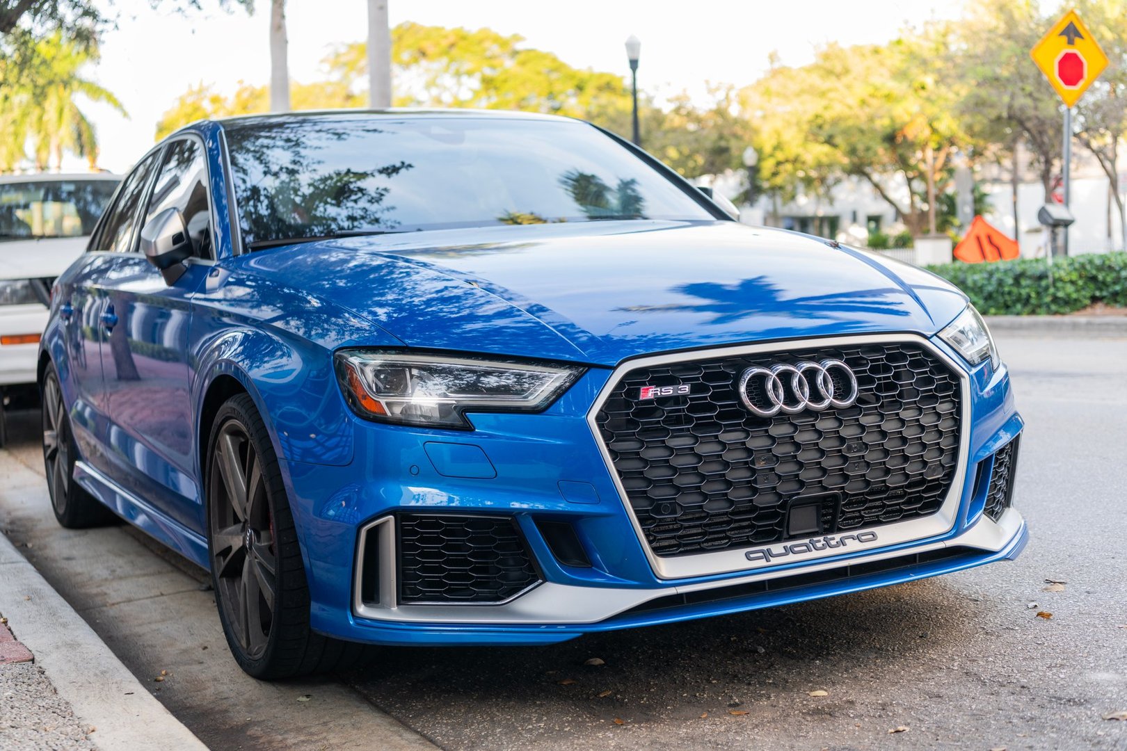 Miami, Florida, USA - December 05, 2024: 2018 Audi RS3 Sport hatchback car. Luxury car of Audi RS3. Car of Audi RS3 parked outdoor. Audi RS3 blue color, corner view.