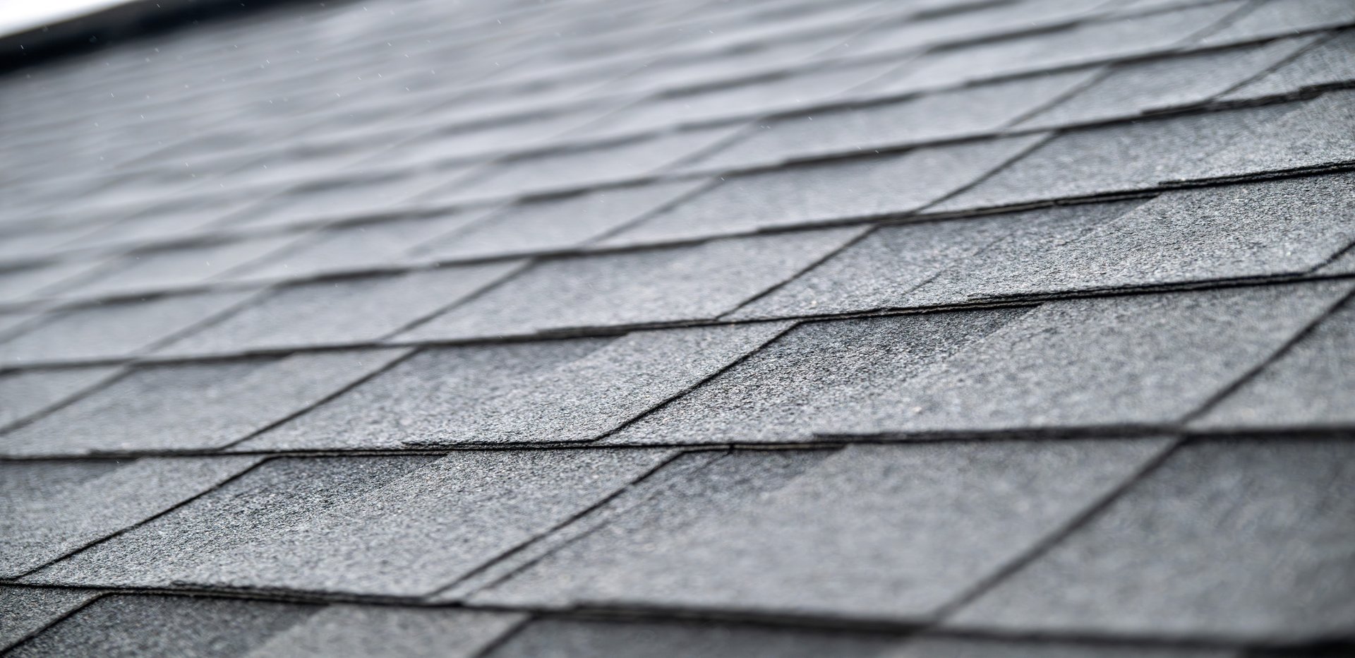 Dark gray asphalt roof shingles