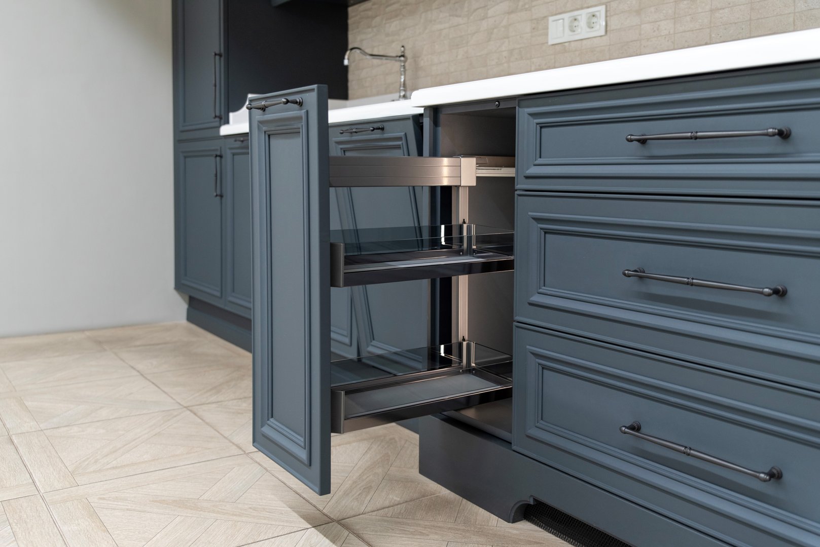 Open kitchen drawer with metal shelves