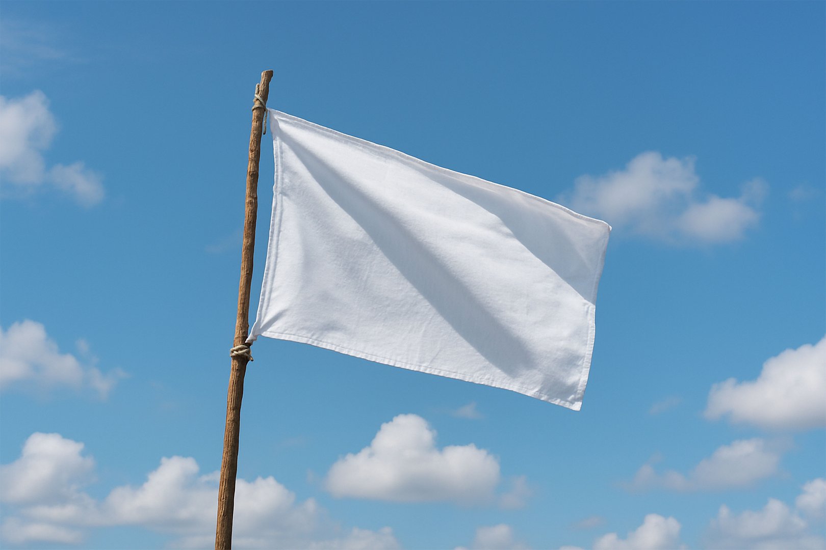 A realistic photograph of a white flag tied to a wooden branch, fluttering in the wind with natural lighting. The background features a bright sky with scattered clouds, creating a peaceful and atmospheric composition. Ideal for concepts of surrender, peace, freedom, or symbolism.