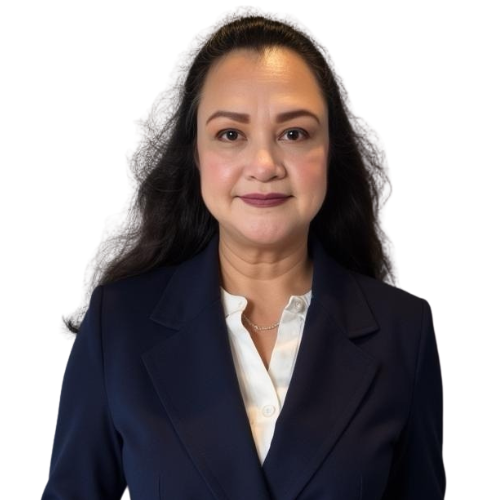 Woman in a navy blazer and white shirt with long wavy black hair, posing against a plain white background.