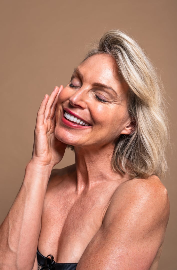Beauty portrait of beautiful mature woman, concepts about cosmetics, skincare and wellness. Mature woman experiencing skincare moments with serene closed eyes