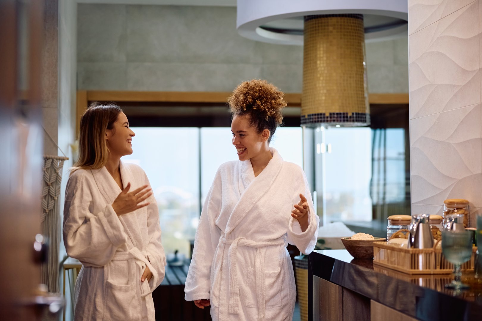 Young happy women having fun while spending a day together at health spa.
