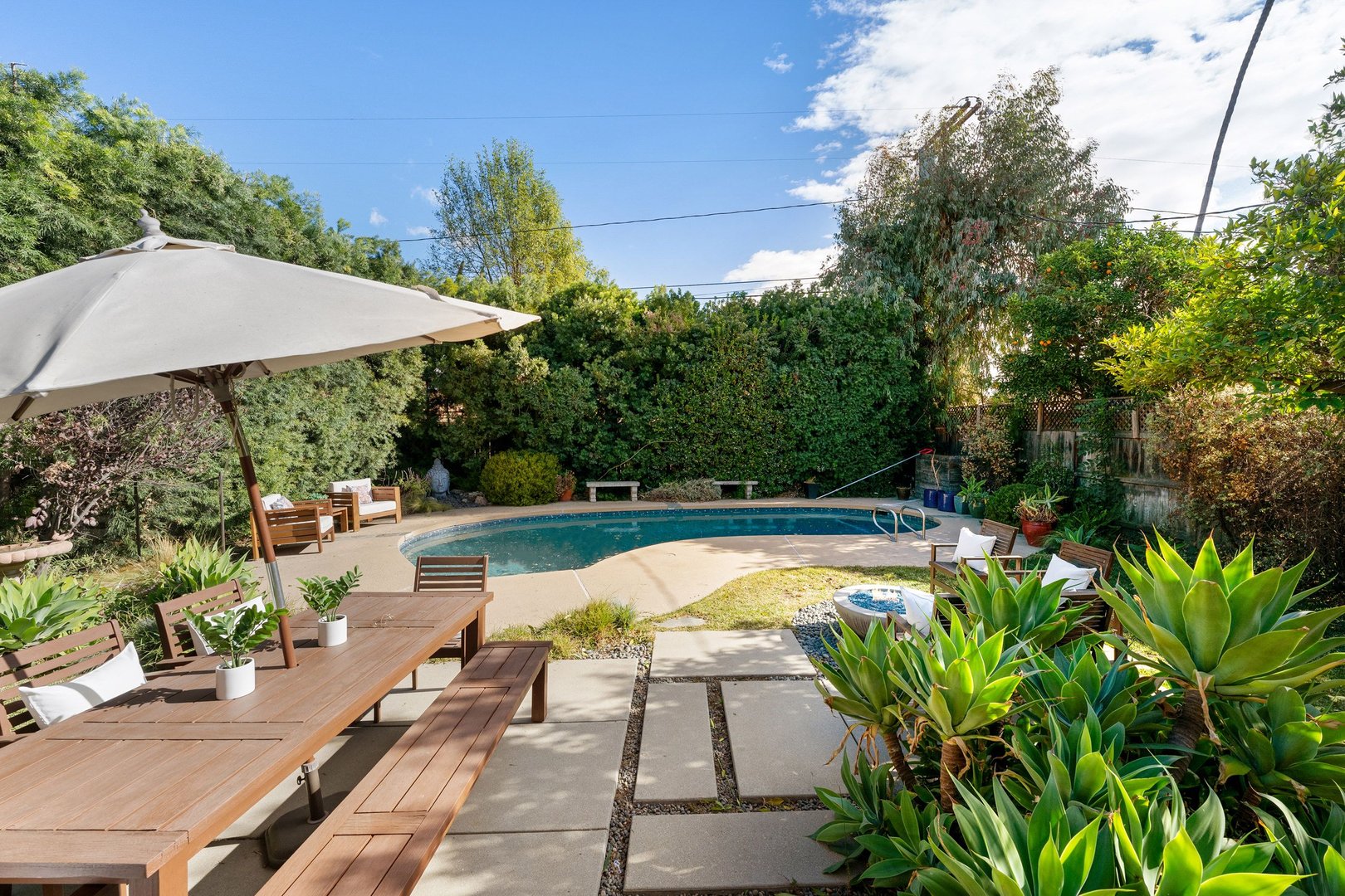 Swimming pool renovation South Louisiana - backyard pool with outdoor living features