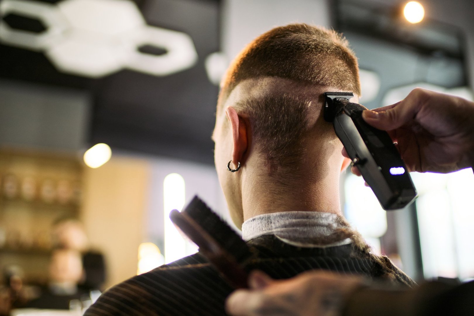 Men's fade haircut in Sarasota - expert barber giving precision fade at The Q Salon