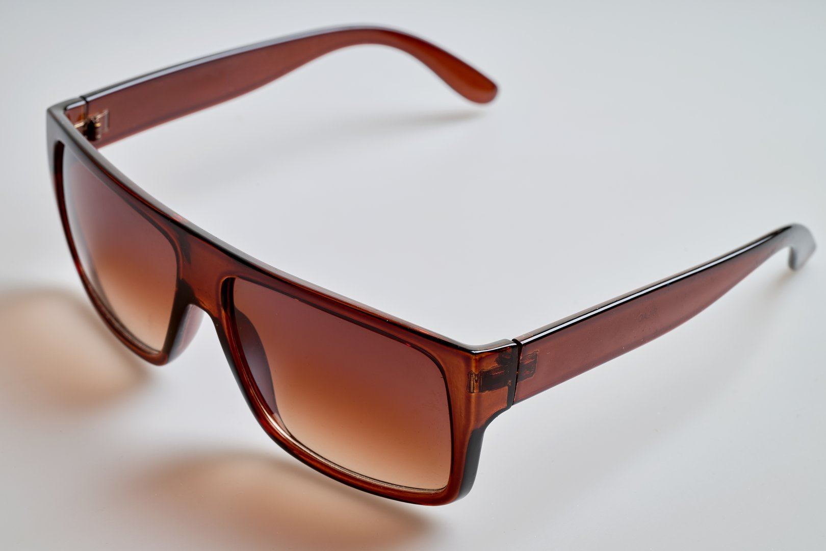 Old and vintage Brown sunglasses on white background