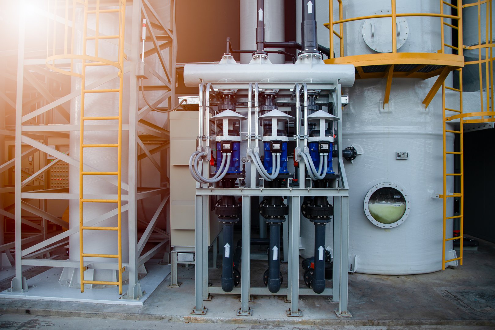Pumps and piping in water treatment facilities,Pump station for reverse osmosis industrial city water treatment station. Wide angle perspective. Technology, chemistry, heating, work safety, supply, infrastructure