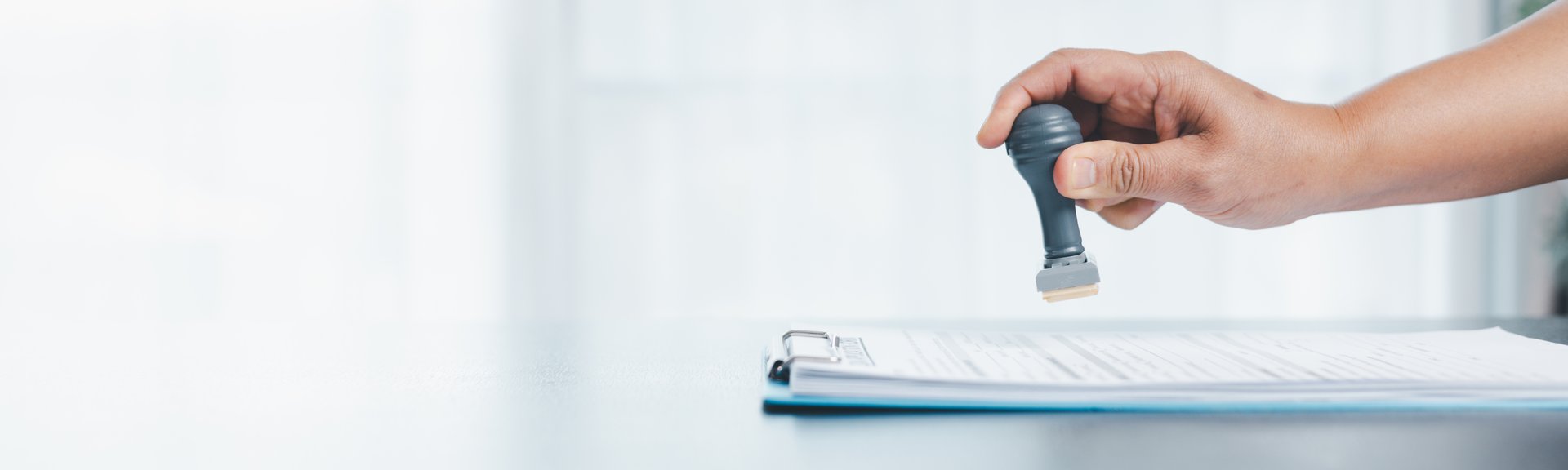 Banner of businessman hands stamp approve on financial business approval document paper. hand accepted permit contract agreement. Broker manager sign contract bank guarantee approved application form