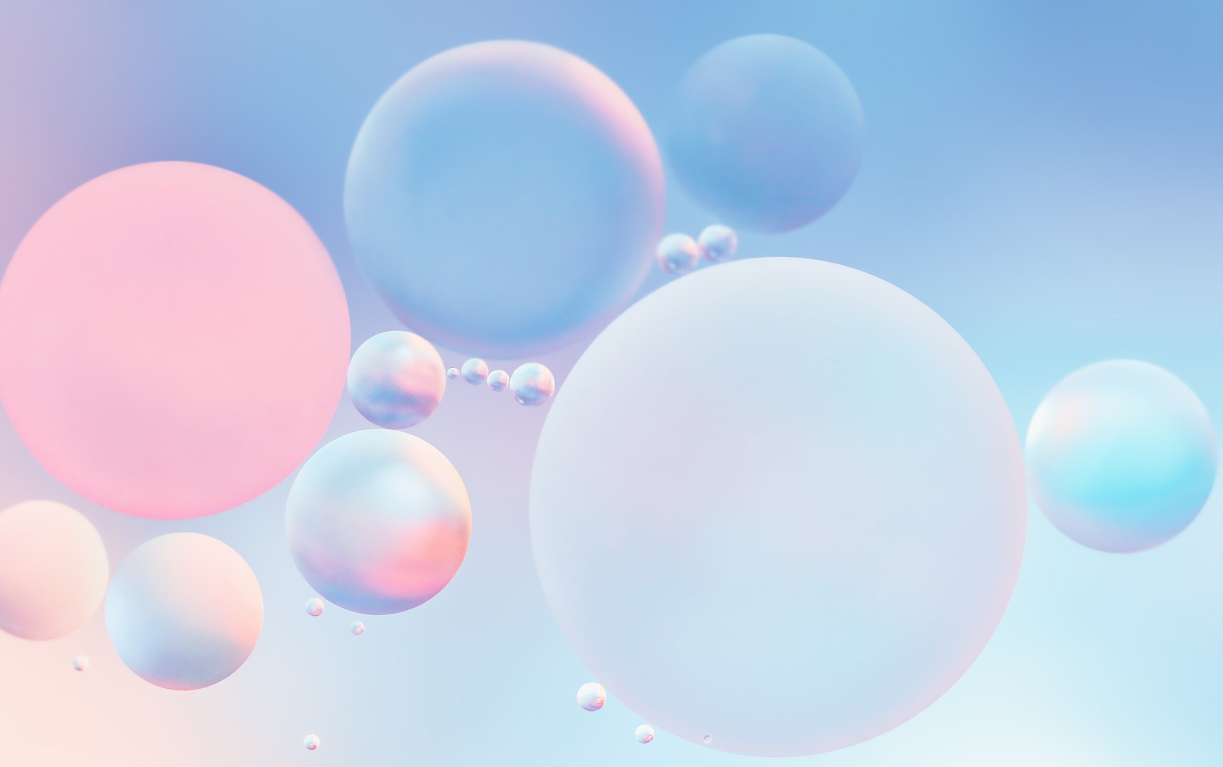 Abstract macro photography of water and oil in soft pastel shades of pink and blue