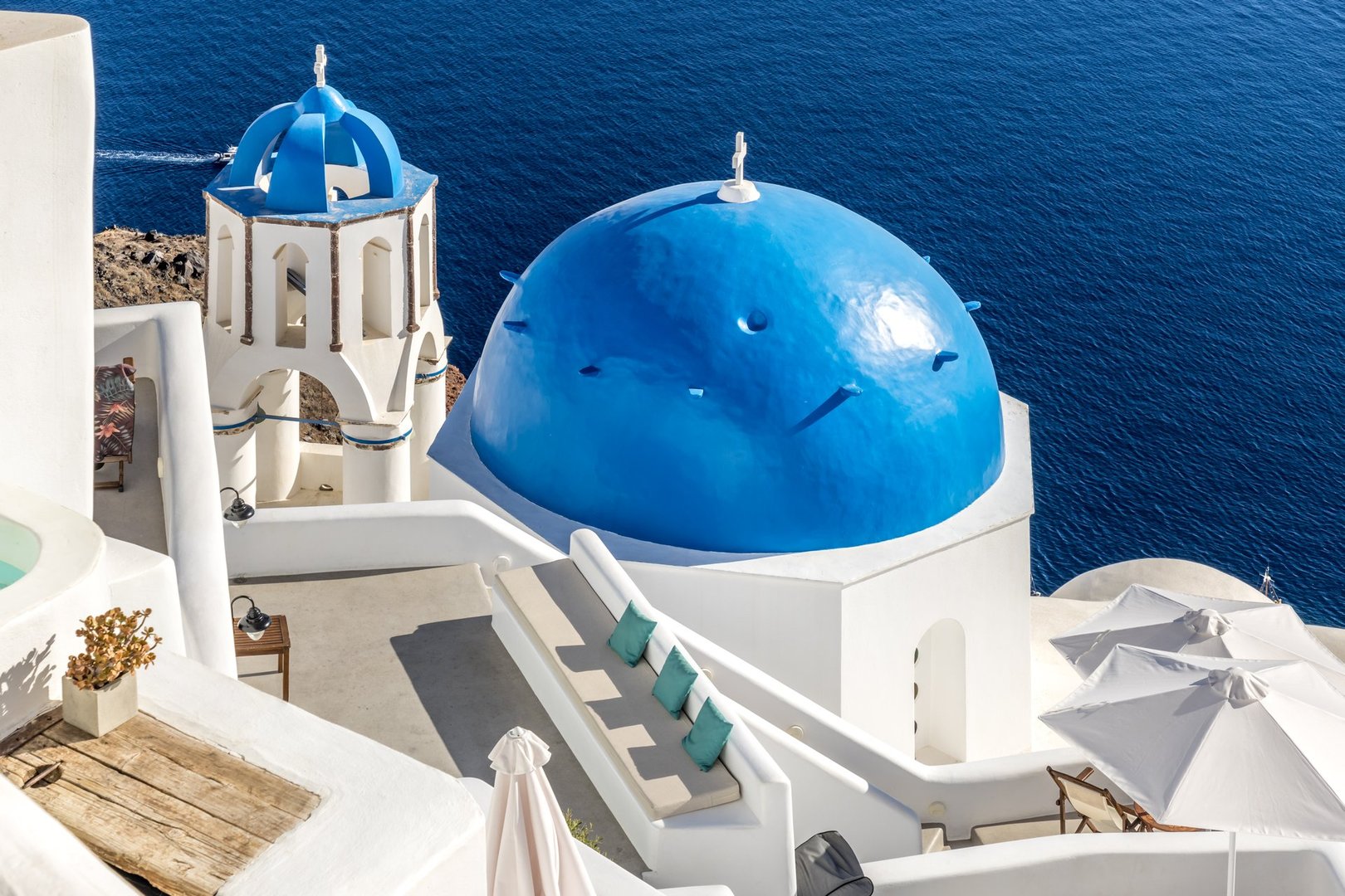 Wonderful white church with a blue dome on the island of Santorini, Greece