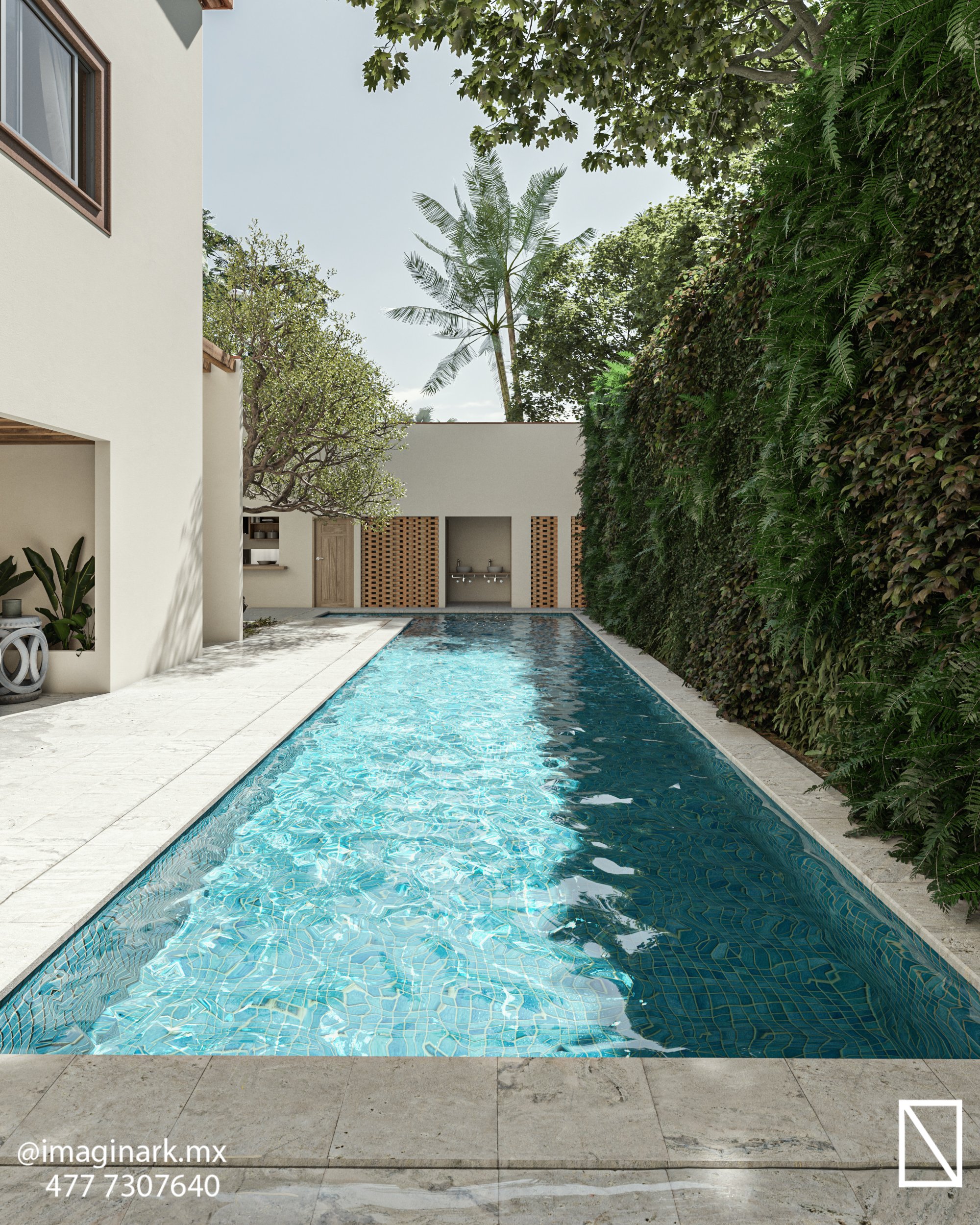 Narrow outdoor swimming pool with clear blue water, surrounded by lush greenery and a minimalist house in the background.