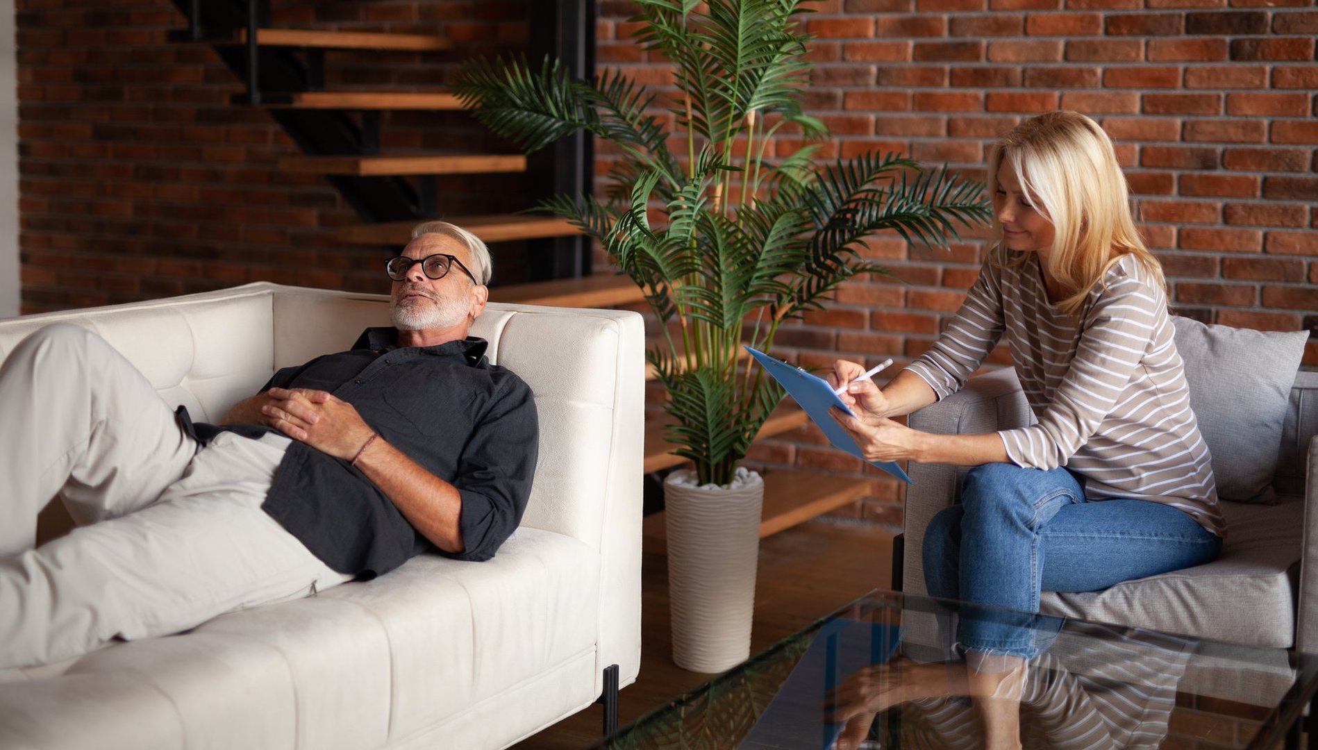 Mature man lying to a psychologist. Psychotherapy, problem analysis. Hypnosis.