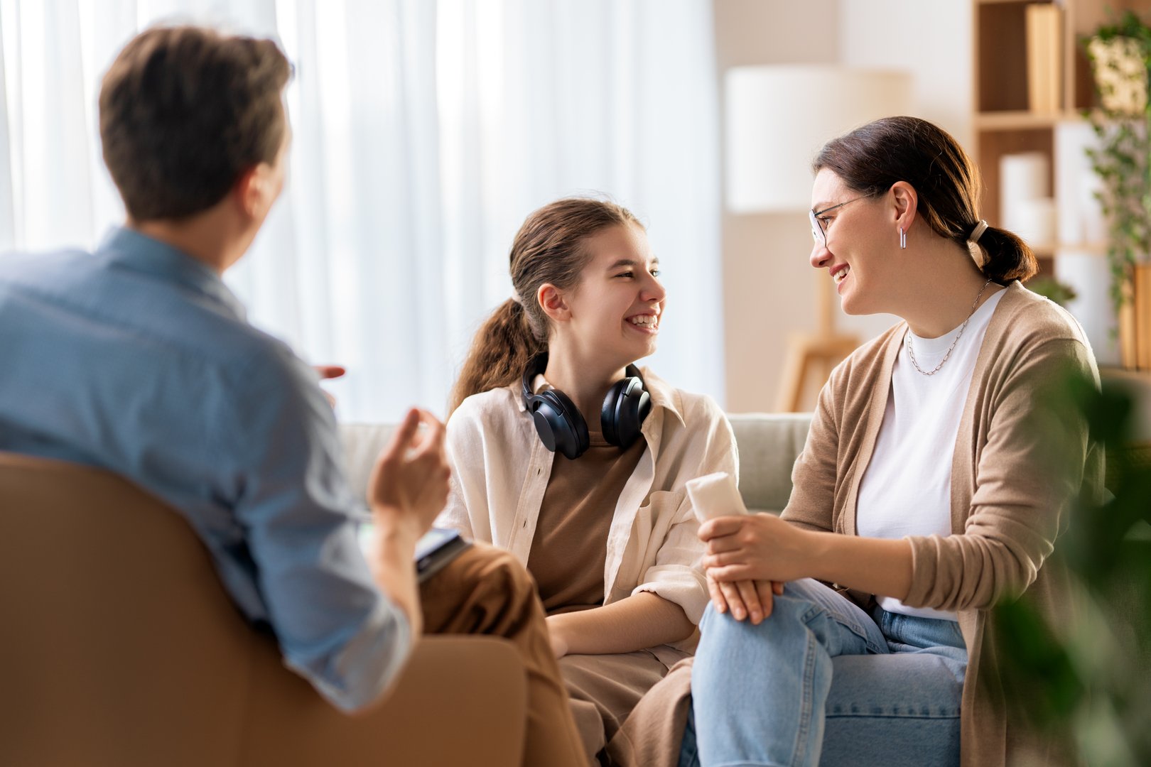 Consultation of teenager and mother on reception for psychologist.