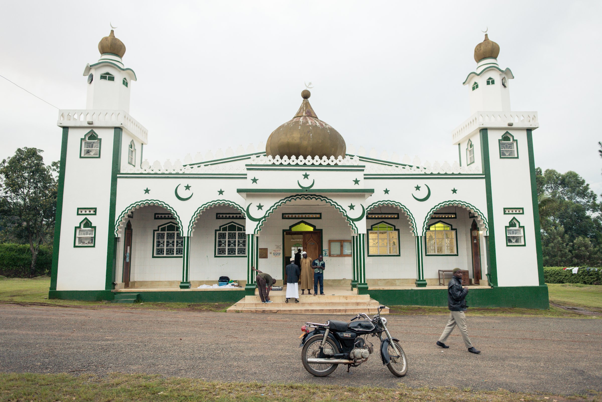 Fort Portal / Uganda - September 30, 2016: beautiful local mosque with motorcycle and people in the main entrance