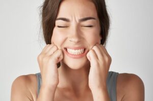 Female patient talking about the toothache