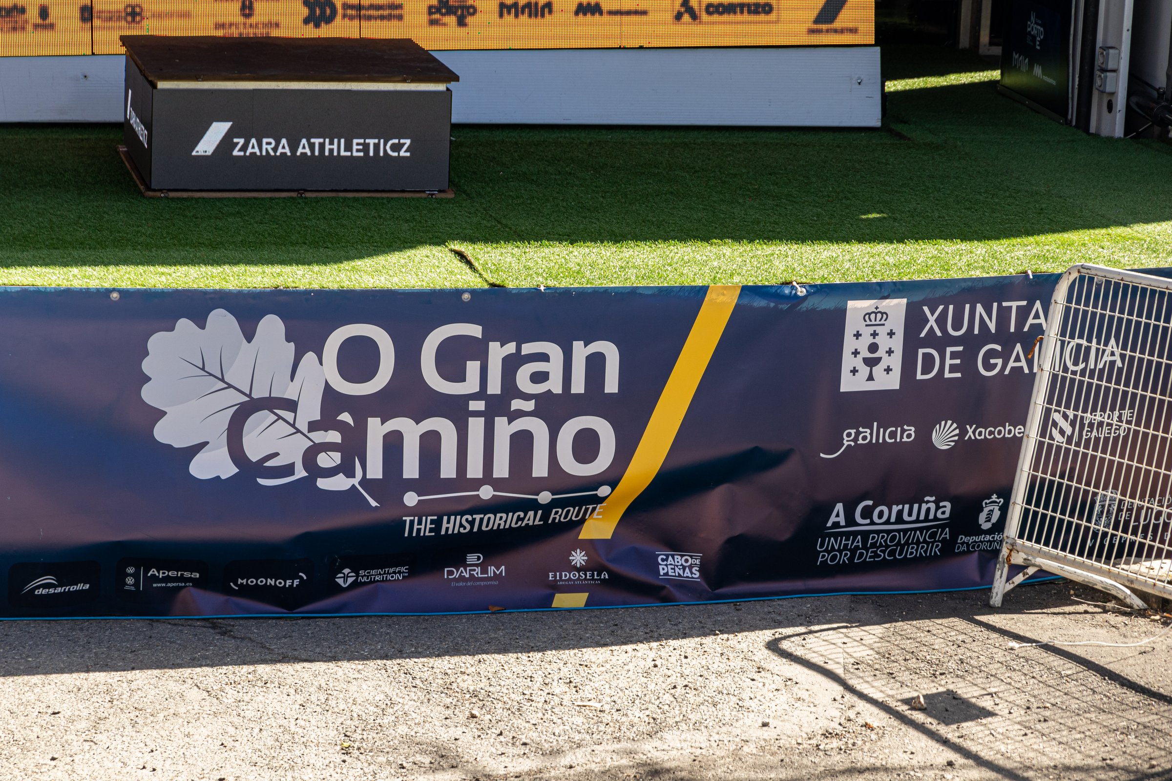 O Cebreiro, Spain. Event structures and banners set up for the finish line of an O Gran Camino 2025 stage in O Cebreiro, with logos of sponsors and race organizers visible
