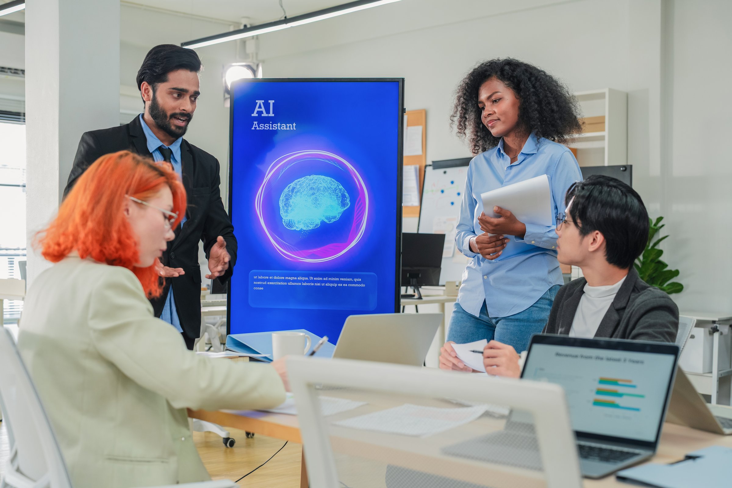Diverse business professionals male and female meet in bright office interior, using AI virtual assistant to brainstorm, connect big data dots, discuss creative strategy teamwork growth and progress
