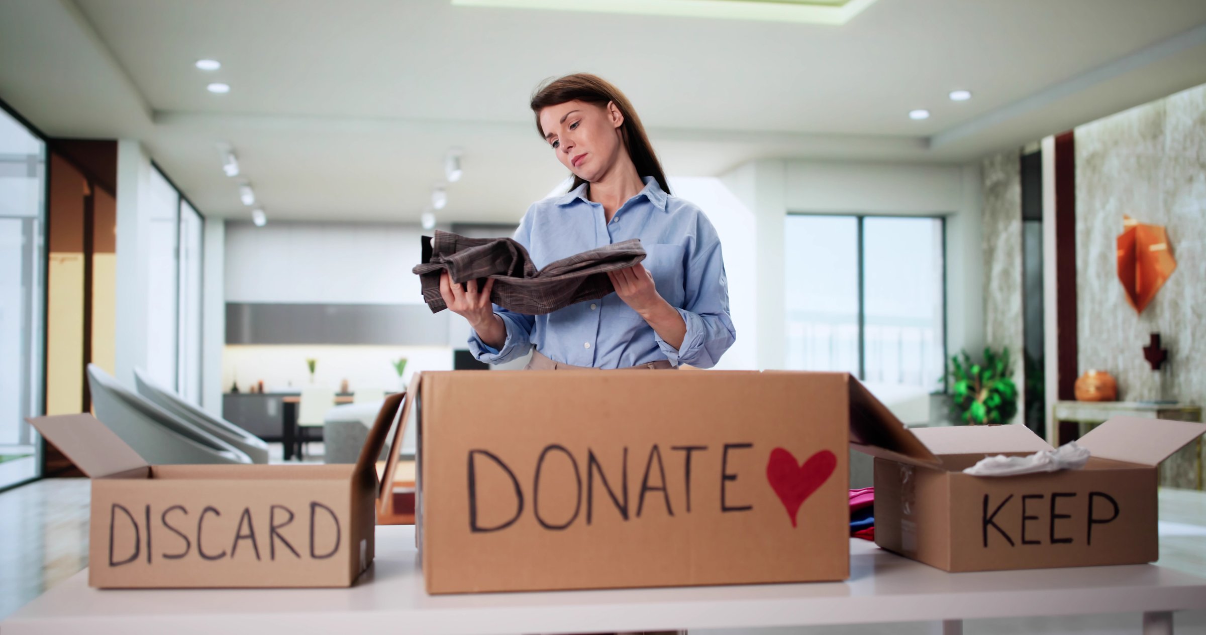 Woman Decluttering Closet, Organizing Wardrobe, Trying On Clothes Selection. Possible Professions: Fashion Stylist