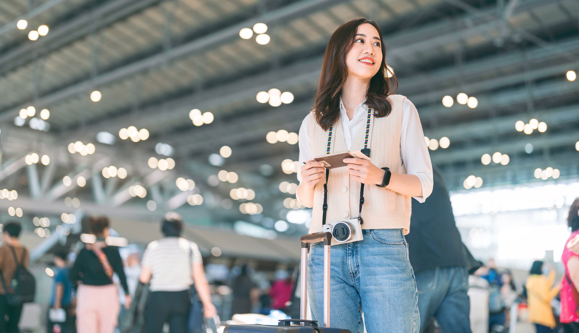 Passenger at international airport terminal for departure with airline transport. Portrait of standing tourist woman to transit with travel luggage on day. People journey on holidays.