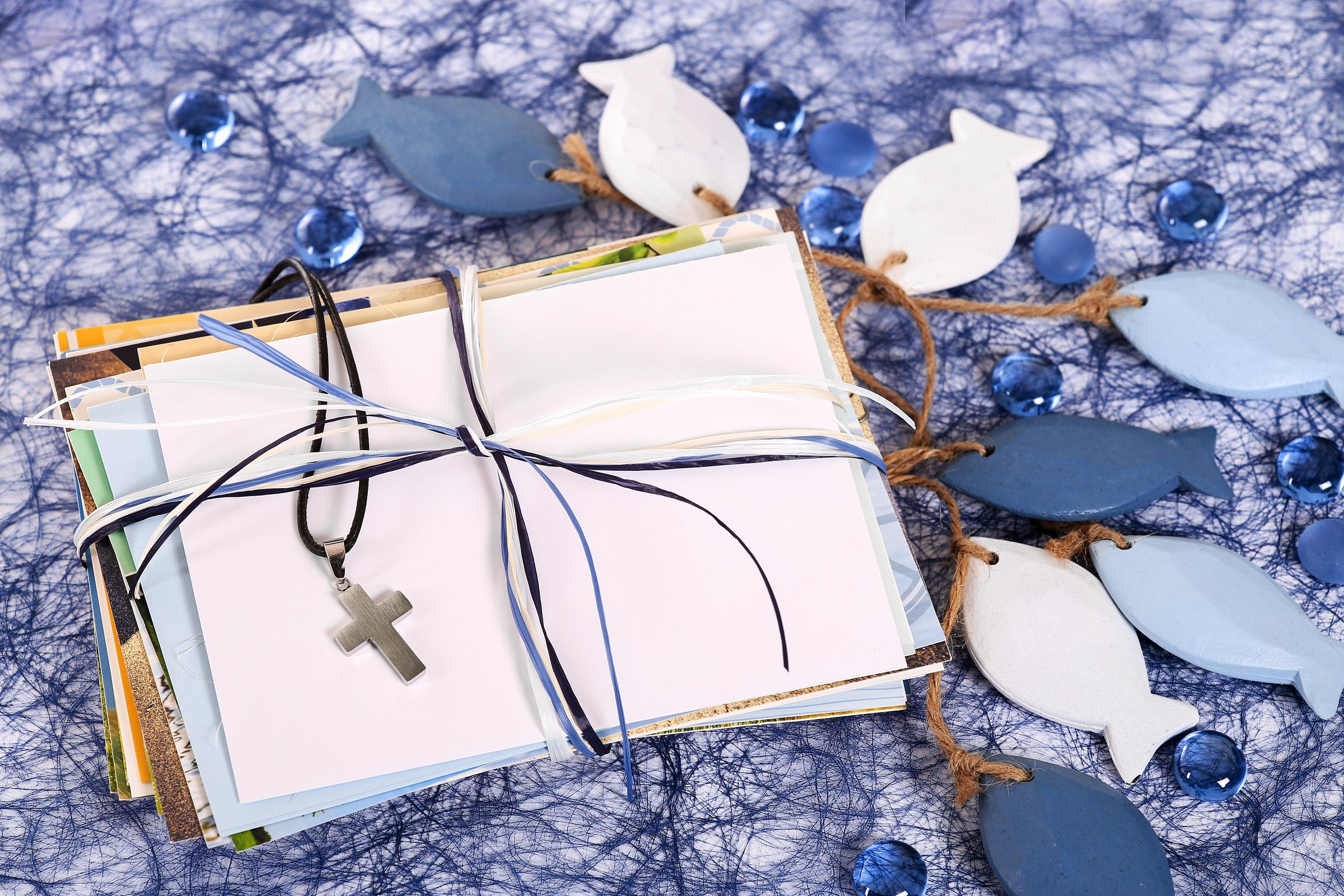 Religious symbols for baptism, communion, confirmation like fishes, greeting cards or crucifix.