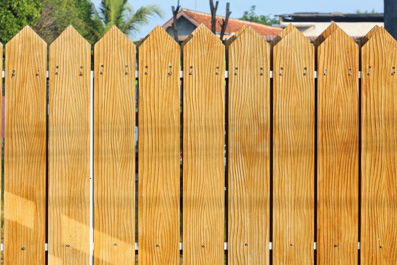 Wooden Fence. House garden wooden fence close up.