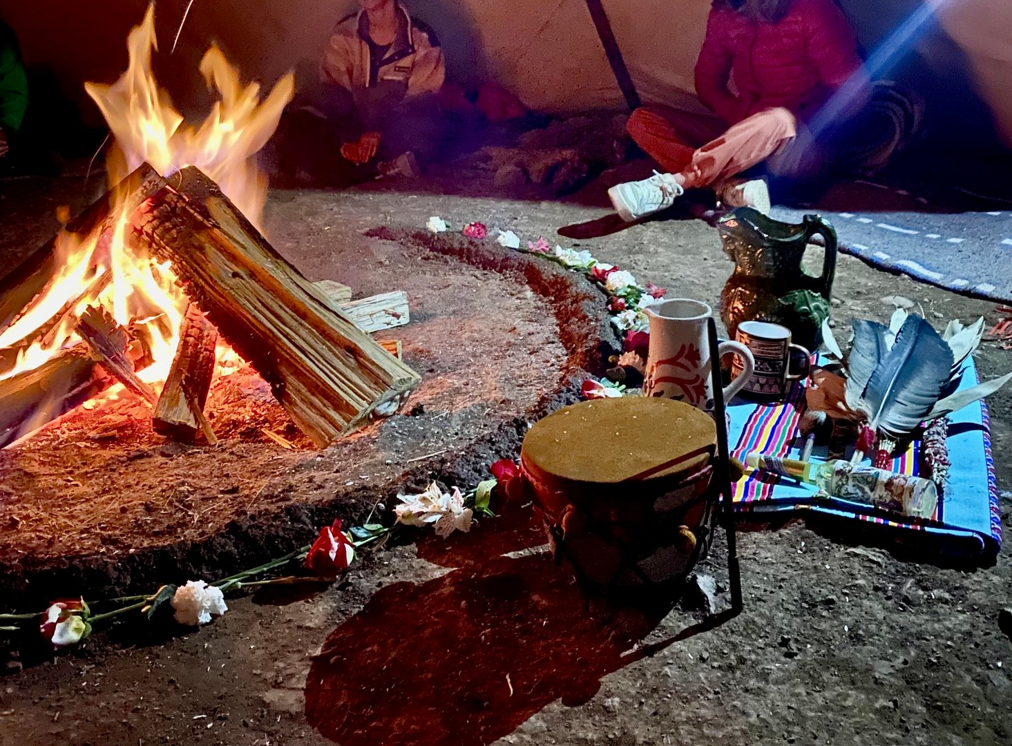 Ancient northern American ayahuasca ceremony with a half moon fireplace in a teepee