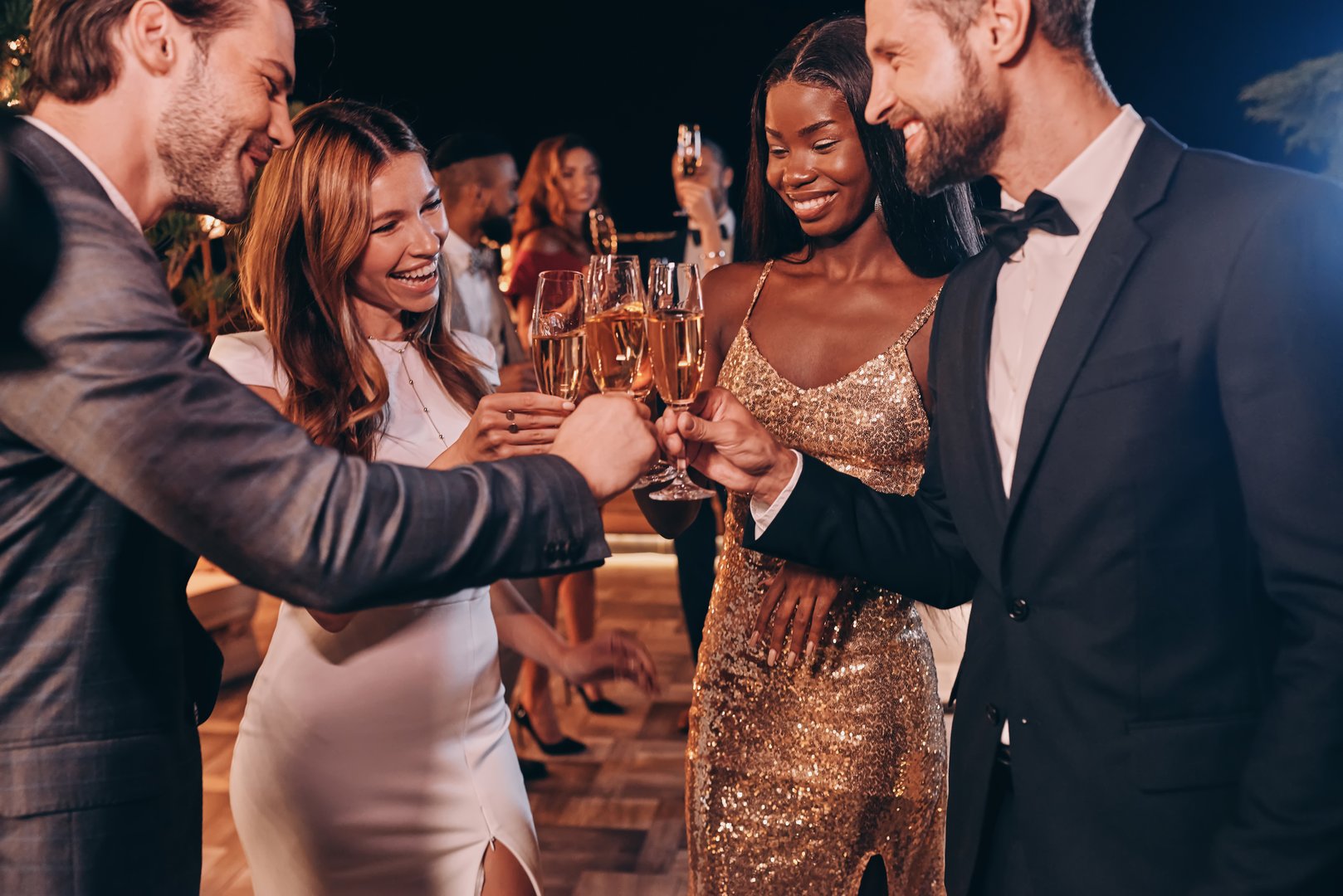 Vibrant party atmosphere with guests enjoying cocktails