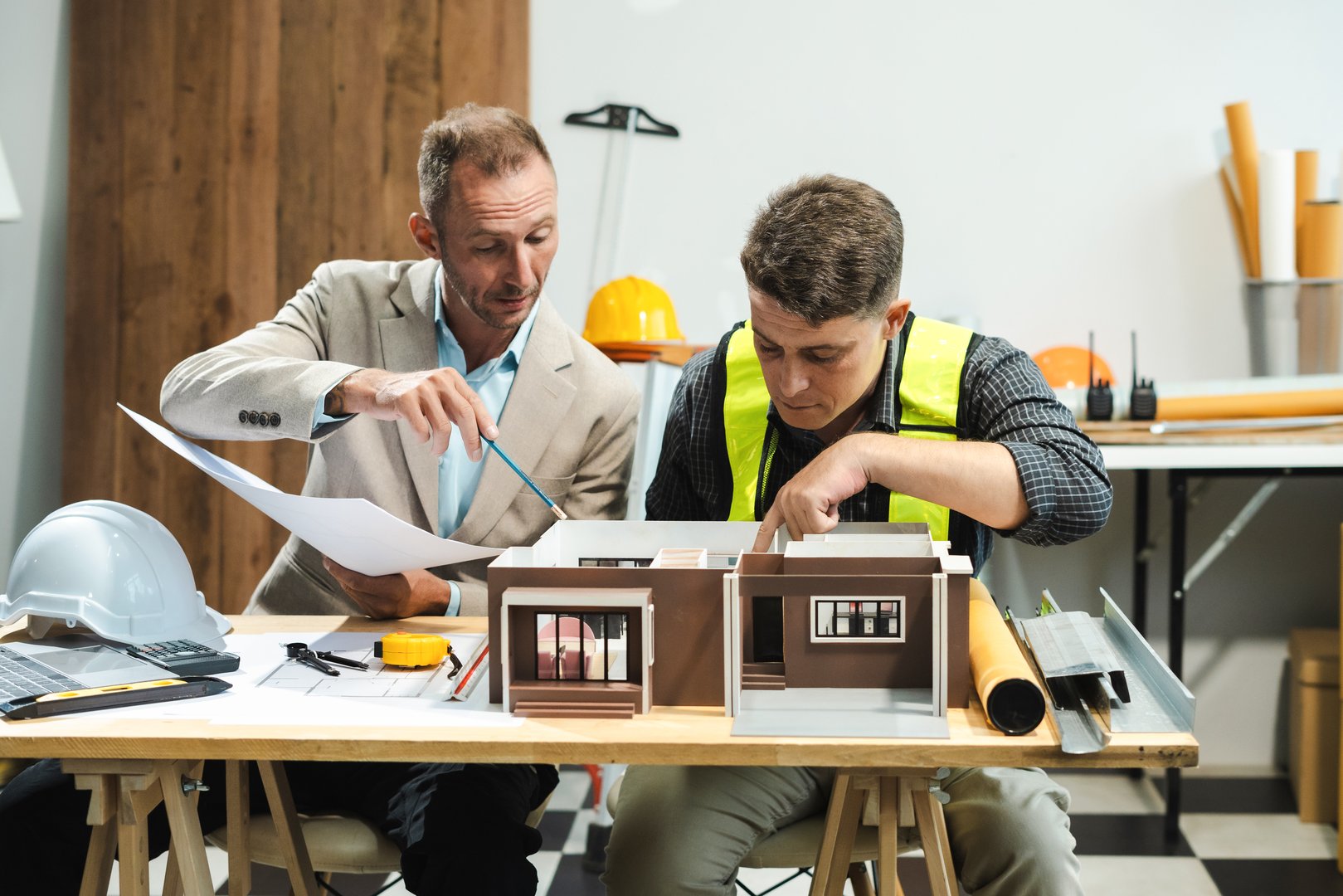 Architect or construction engineer caucasian plan on hard project at work,  industry professional team.