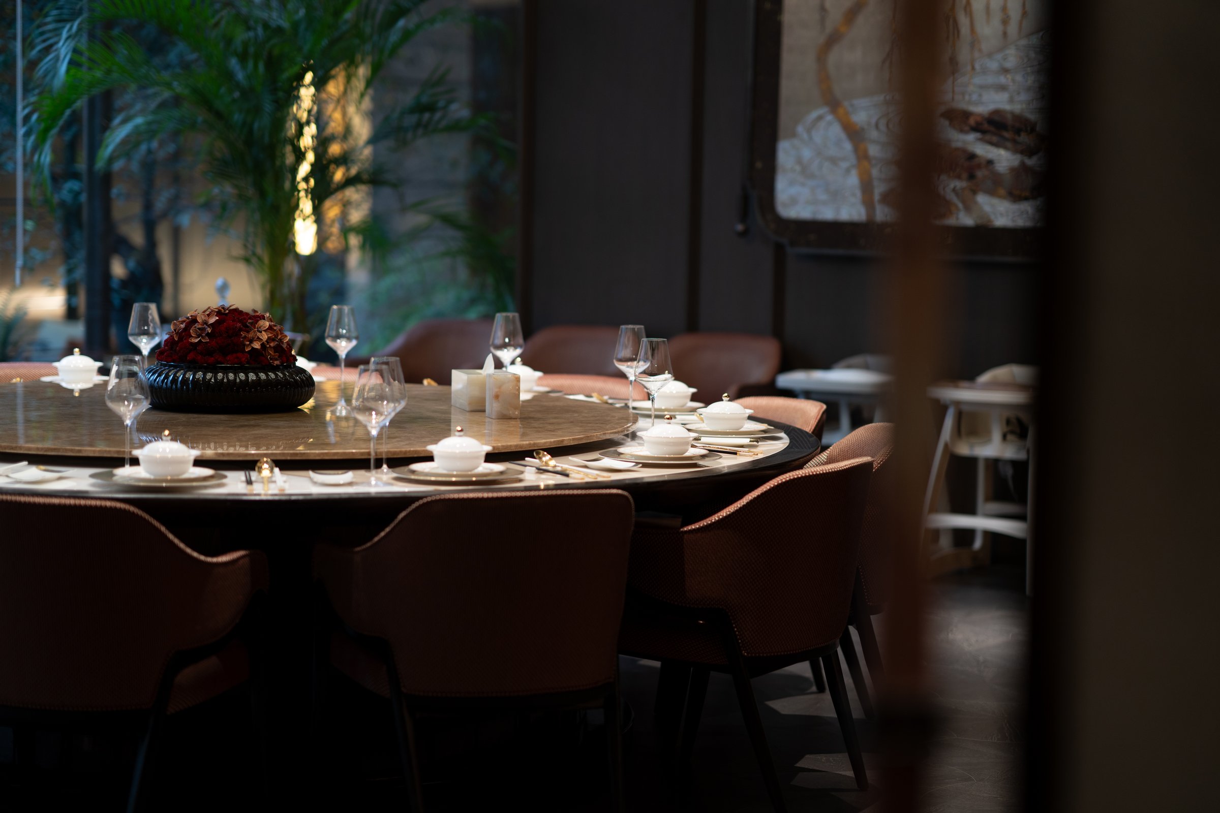 Elegant dining setup by garden view