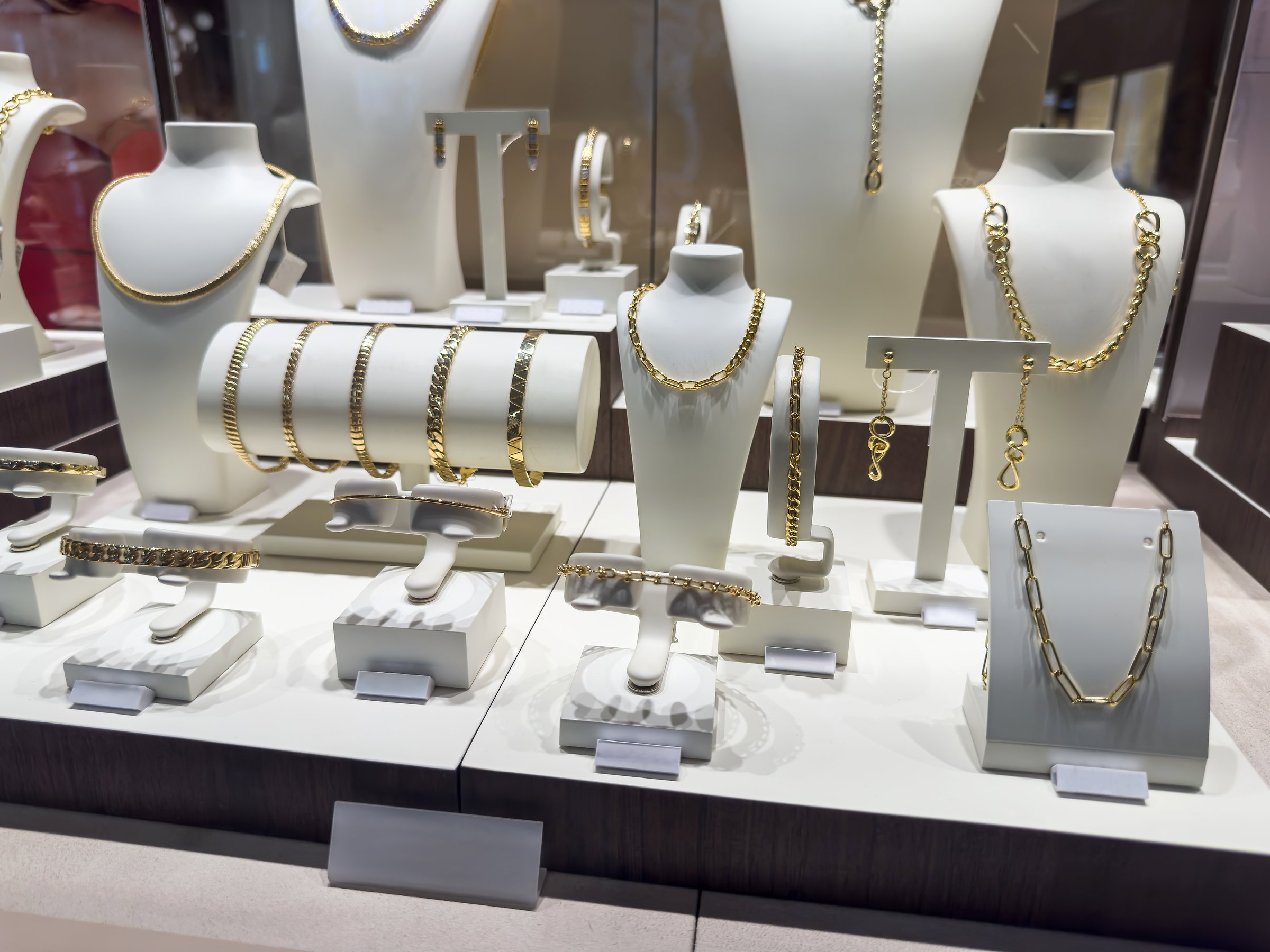 jewelry stands with a large assortment of gems   in a shop window for decorating a jewelry store. Nobody