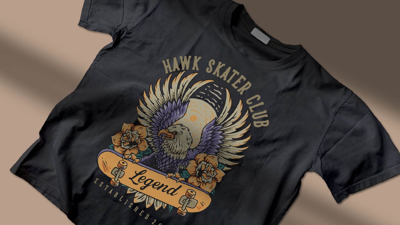 Black t-shirt with Hawk Skater Club design featuring an eagle, moon, flowers, skateboards, and the word Legend.