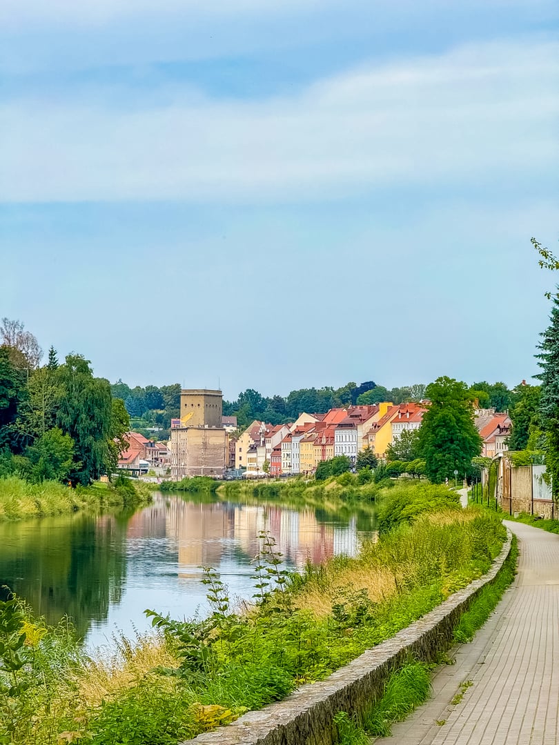 Scenic view of Zgorzelec, Poland, with colorful houses along the river, historic architecture, and tower reflections in the water. European cityscape, summer travel destination on the border with Germany. High quality photo