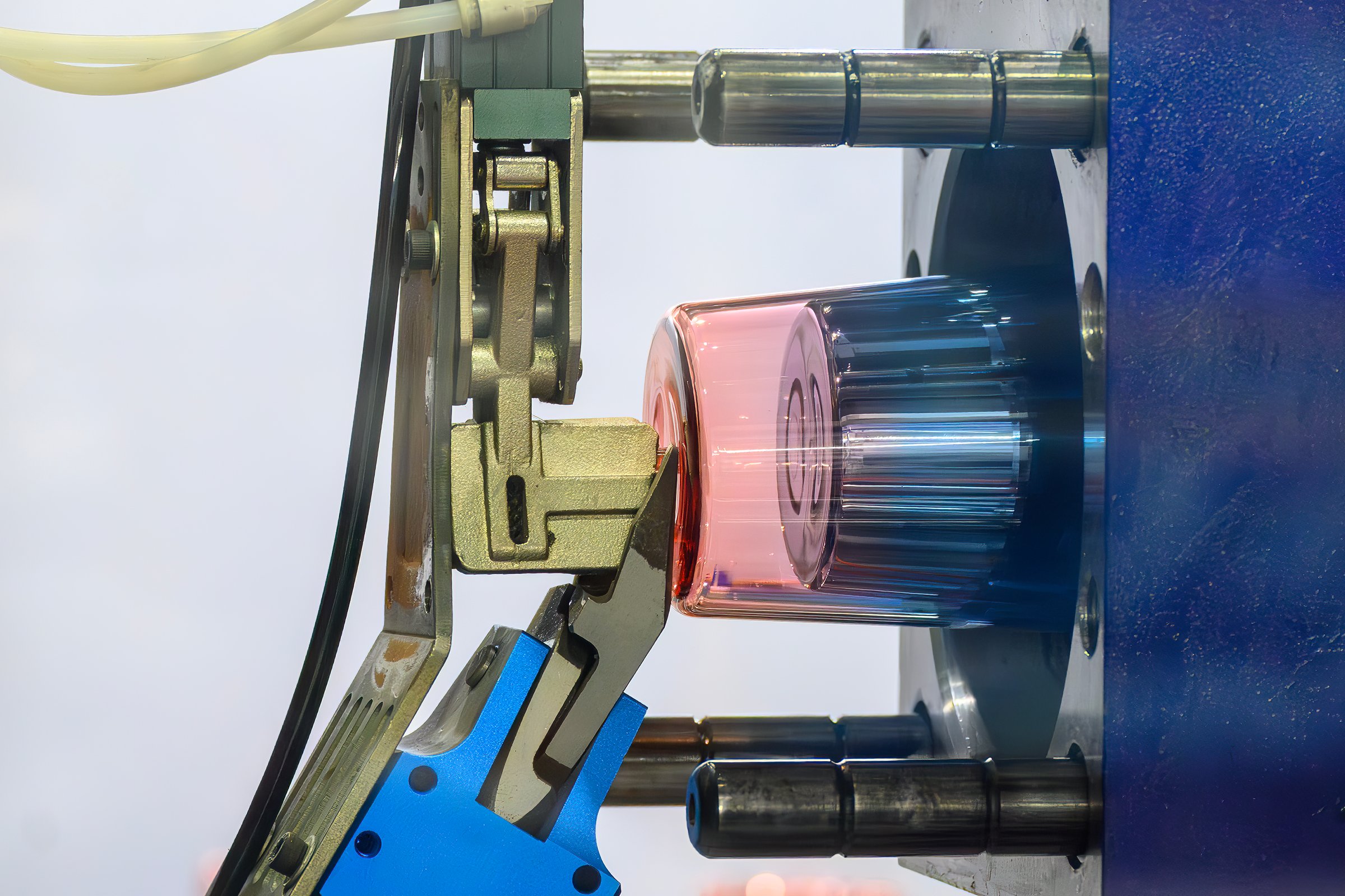 Close up scene the plastic glass parts from injection machine. The plastic parts production process from injection mold machine.