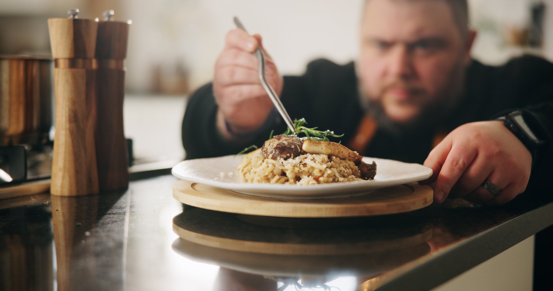 Presentation, plate or hands of man with food in kitchen of home for diet, service or nutrition. Ingredients, risotto recipe or person with dish design for gourmet cuisine, cooking mushroom or lunch