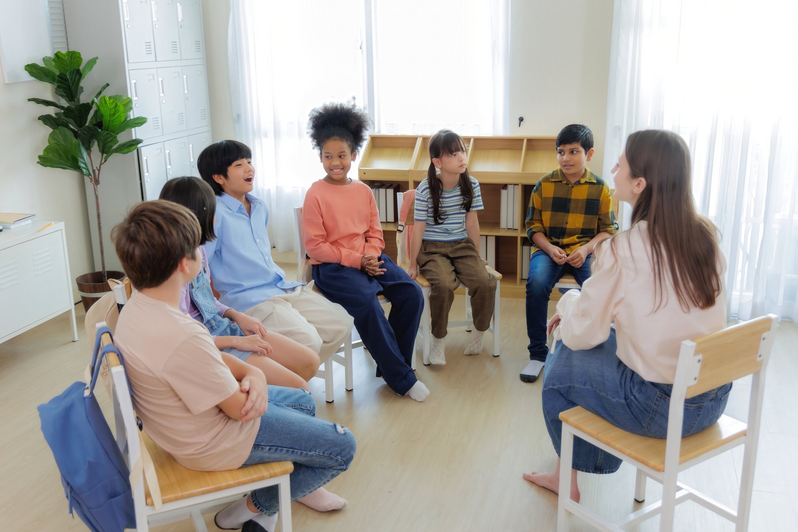 Children in classroom circle activity
