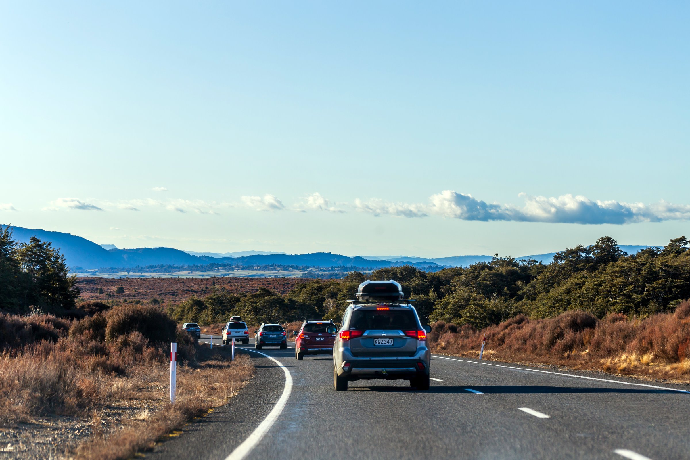 Manawatu-Whanganui, New Zealand - September 09, 2023: A group of cars on a scenic road trip through the tranquil countryside of New Zealand