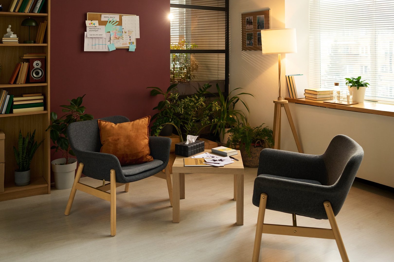 Part of office of modern school psychologist with small table and two armchairs for psychotherapist and patient