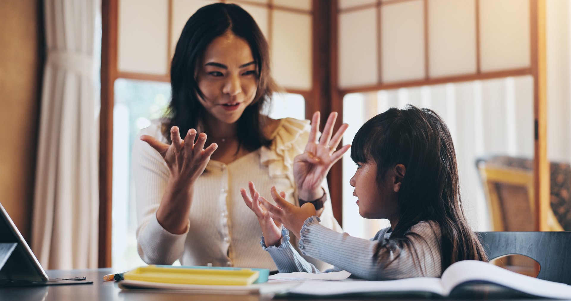 Asian mother, child and counting with fingers for education, homeschooling or youth development at home. Mom, girl or kid with addition, subtraction or number lesson for mathematics tutoring in Japan