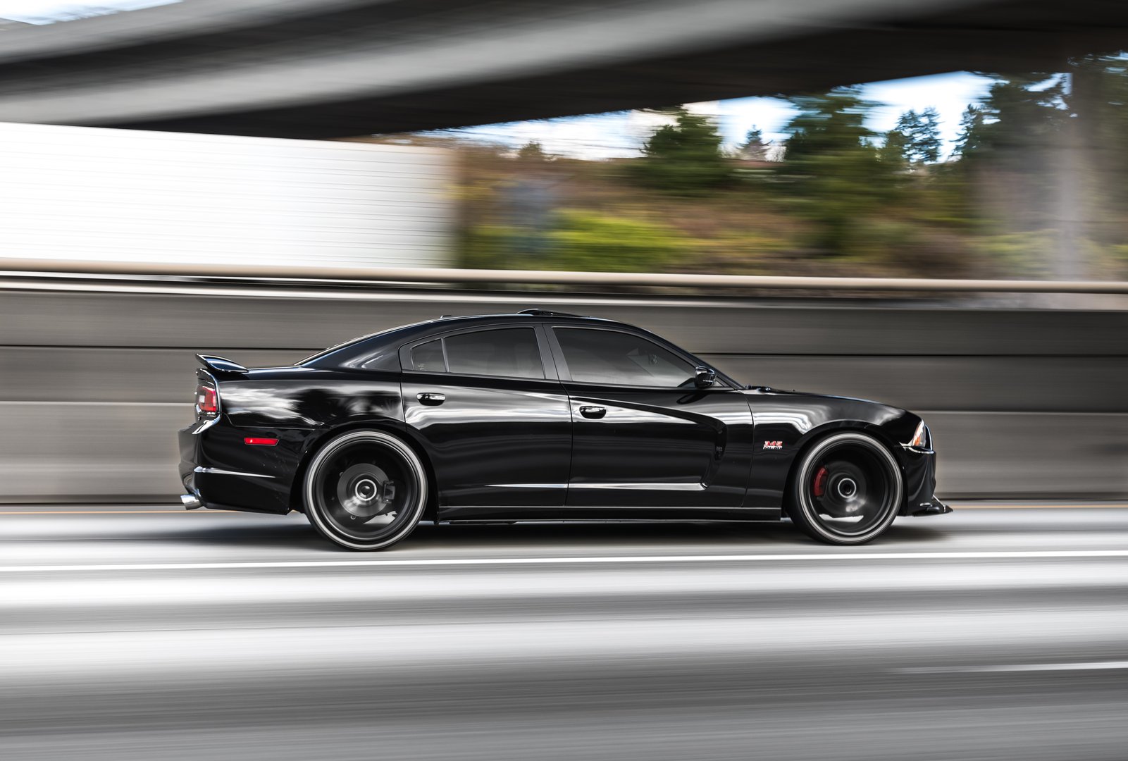 Seattle, WA, USA 9/2/2022 Dodge Challenger driving on the street showing the passenger side of the car