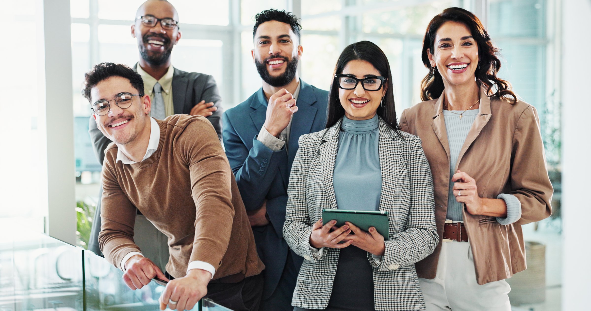 Portrait, legal team and about us in office as colleagues, professional and together in law firm. Happy people, technology and confidence as staff, advisor and consultant in company for collaboration