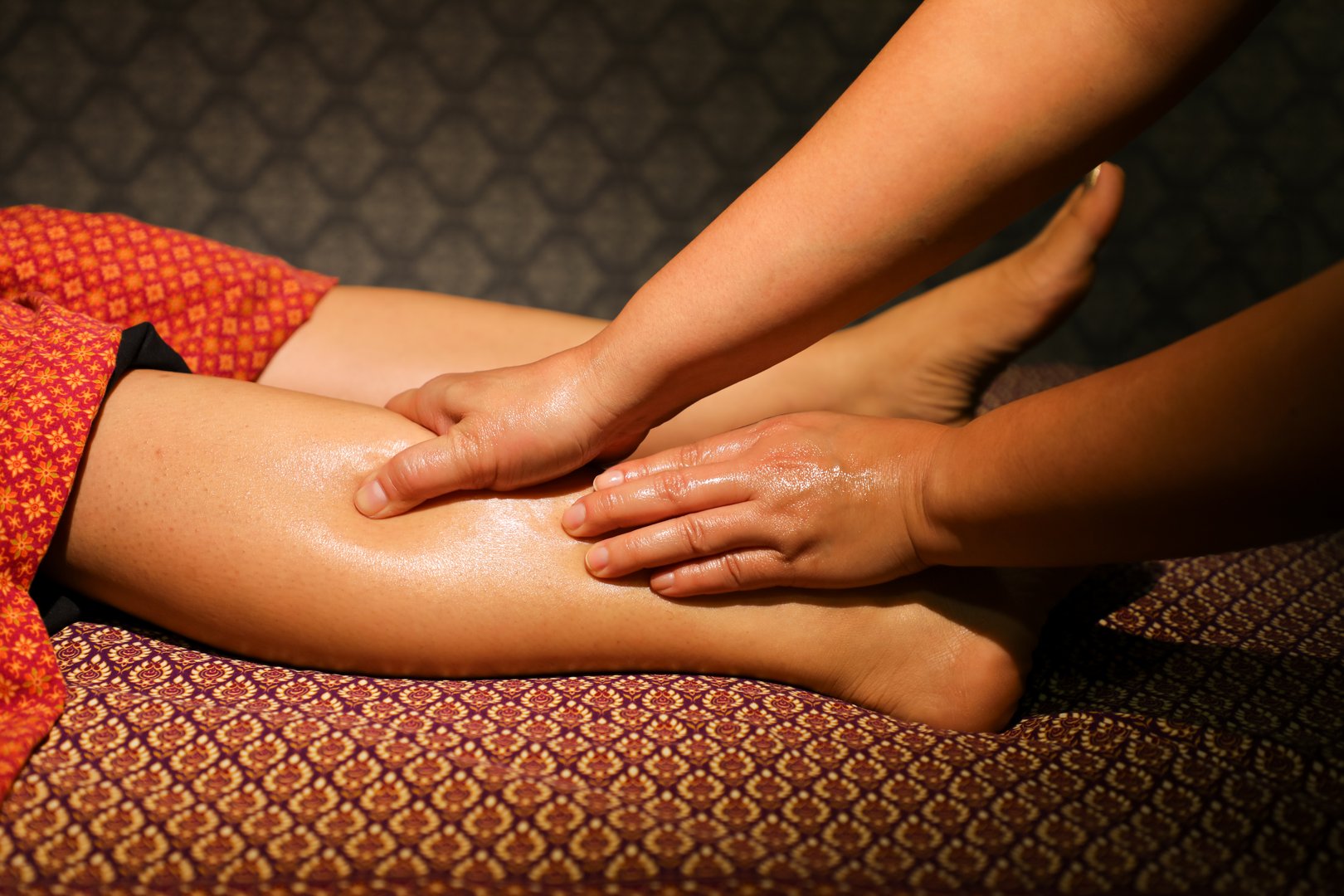 Thai foot massage with massage oil to normalize muscle tone of the lower extremities and relieve fatigue