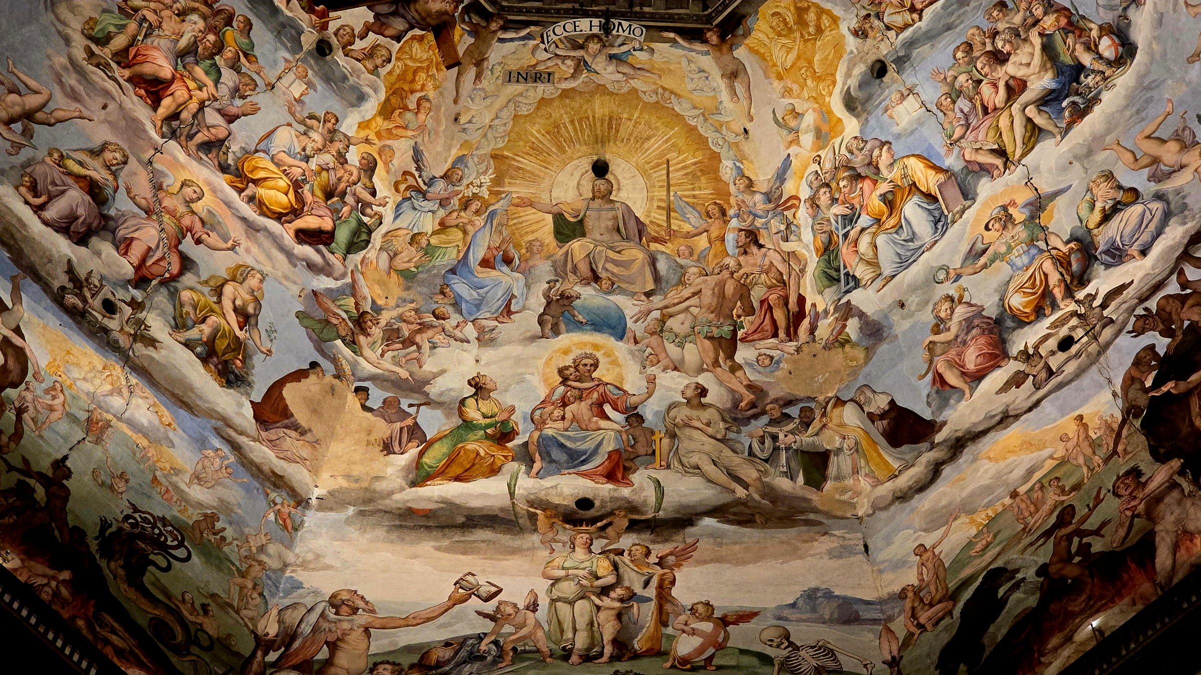Florence, Italy - 3 January 2025. Fresco of the Last Judgment inside the Florence Duomo dome, showing Christ in glory surrounded by saints, angels, and scenes of heaven and hell.