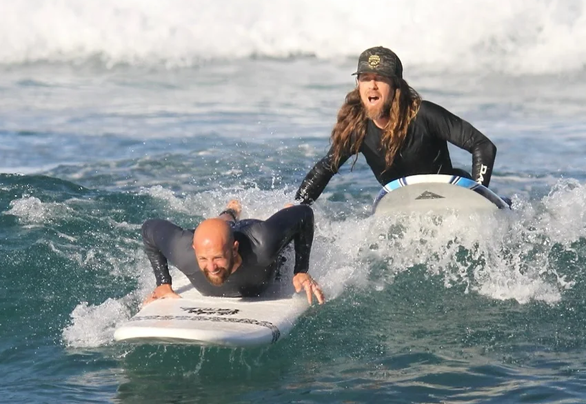Surfing lesson on the Big Island with instructor and student