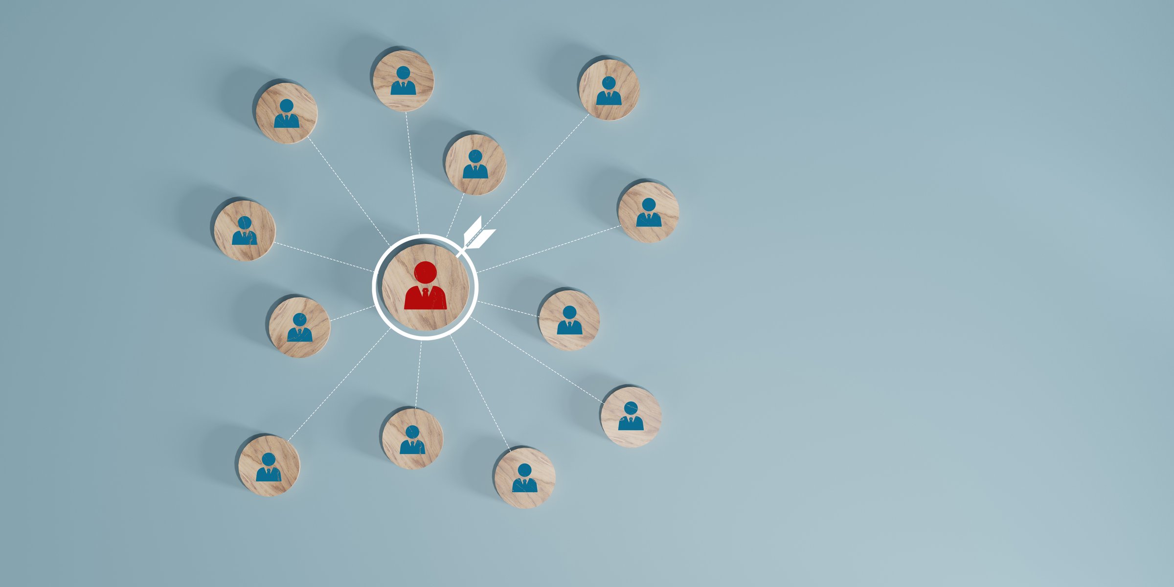 Organizational structure displayed with wooden pegs and connecting lines on a backdrop.