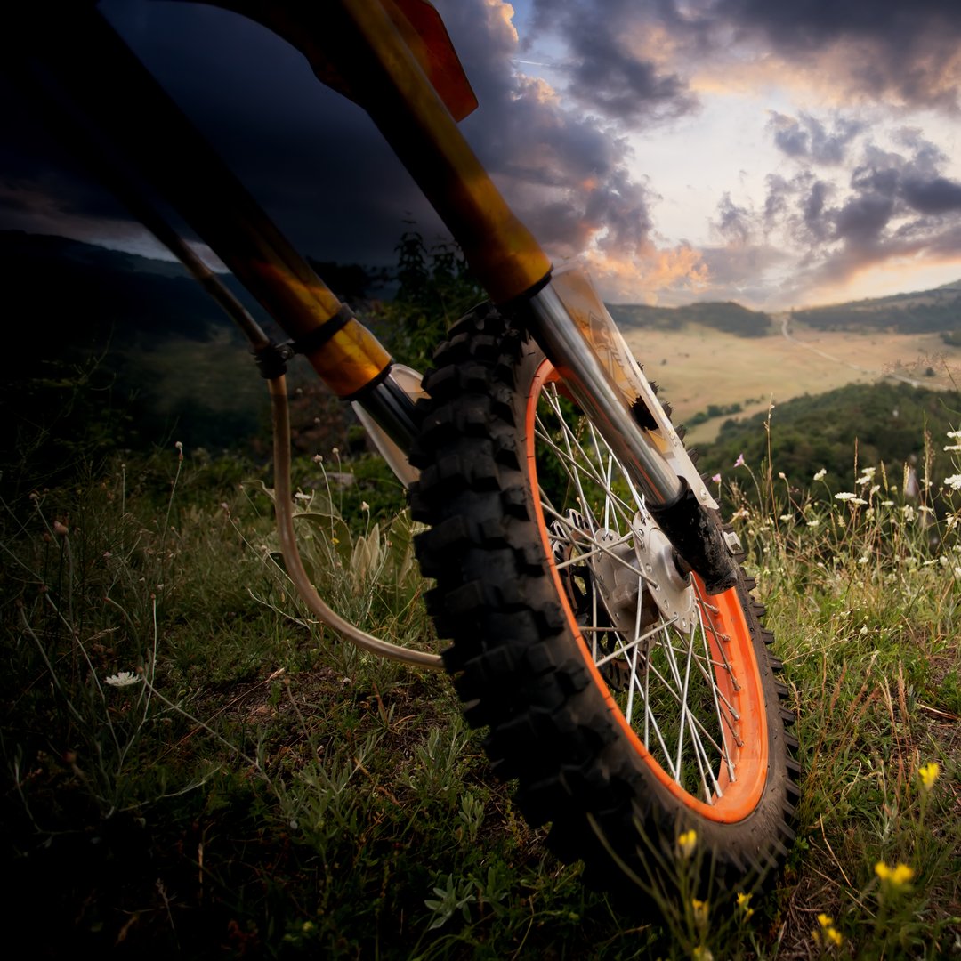 dirt bike close-up details over the scenic HDR sunset