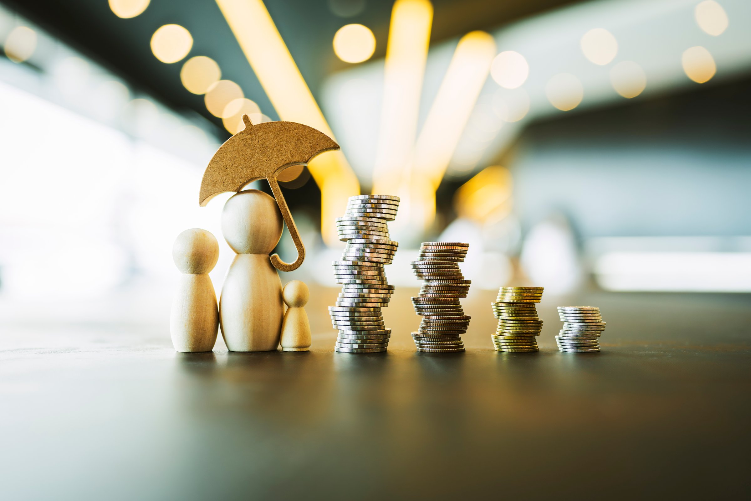 Umbrella icon and family model, Security protection and health insurance. The concept of family home, protection, health care day, car insurance.