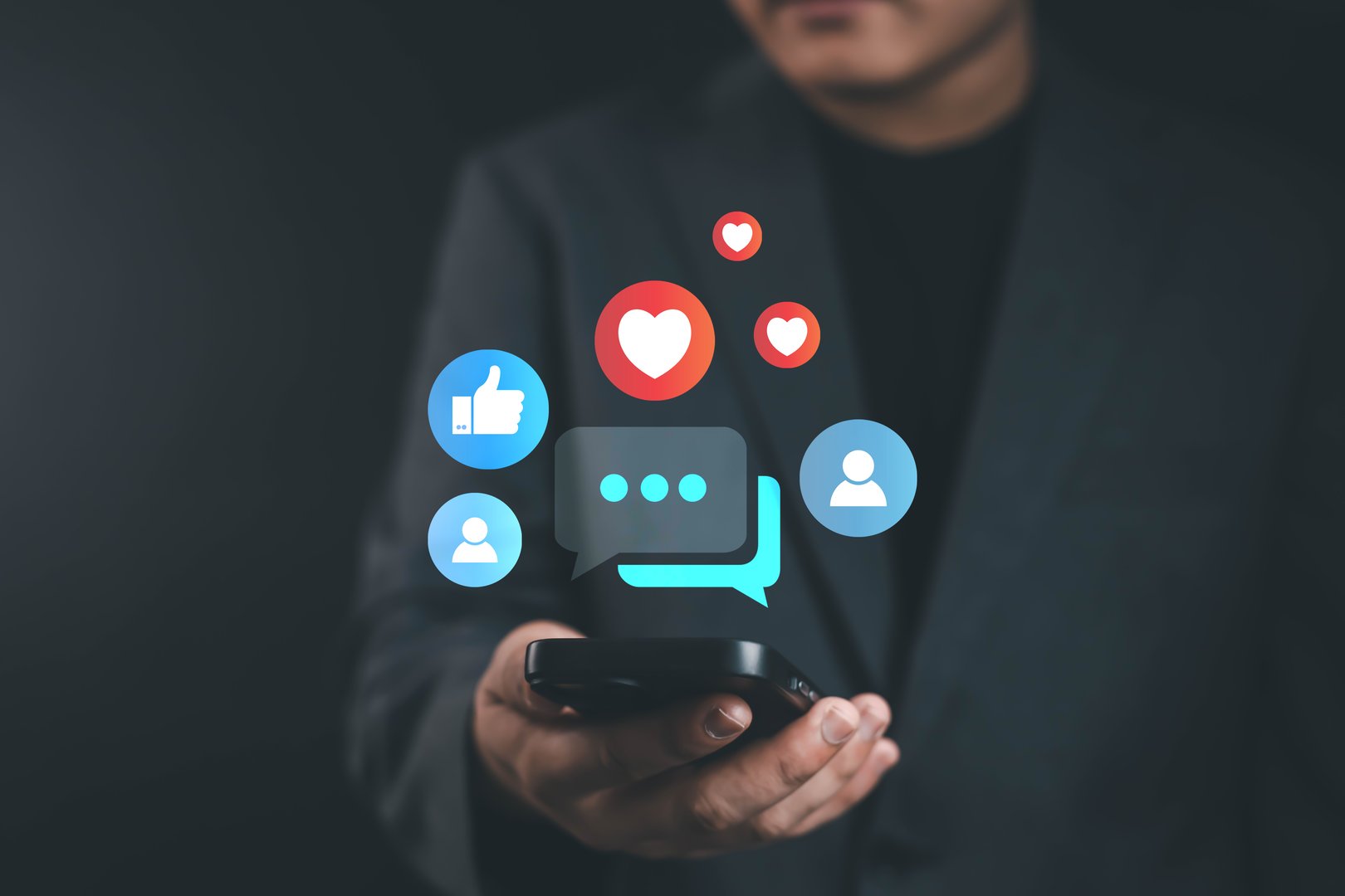 Businessman using smartphone with social media icons, concept of online communication, digital marketing, social engagement, customer interaction, and modern business connection.