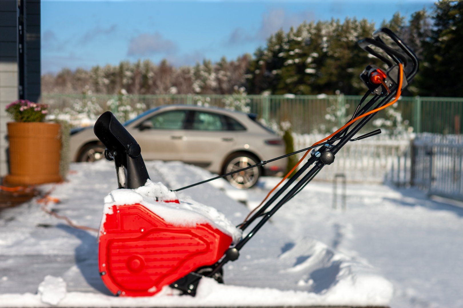 a snow thrower in the yard after a snow storm, sunny day shot
