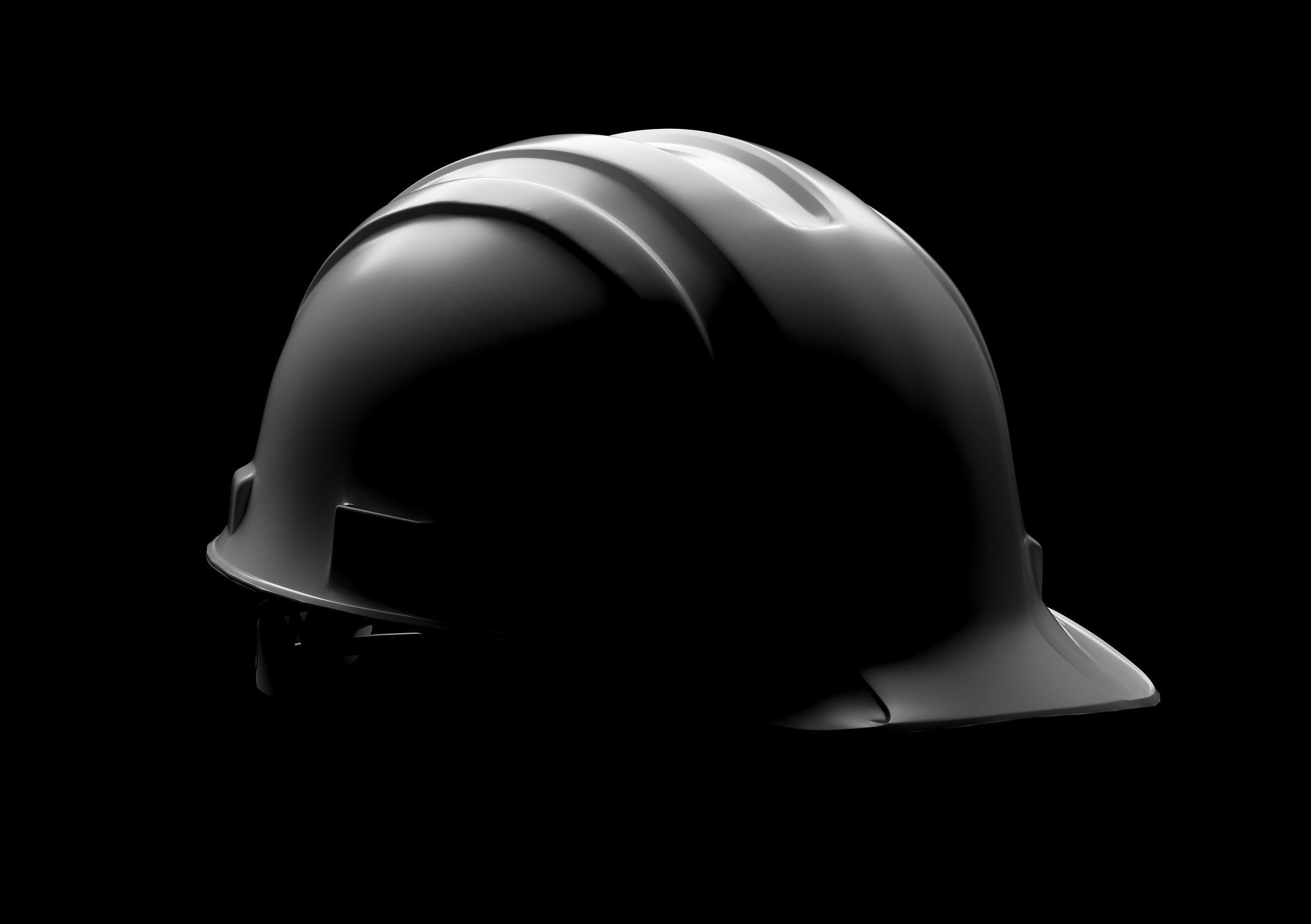 Dramatically Lit Hard Hat Isolated on a Black Background.